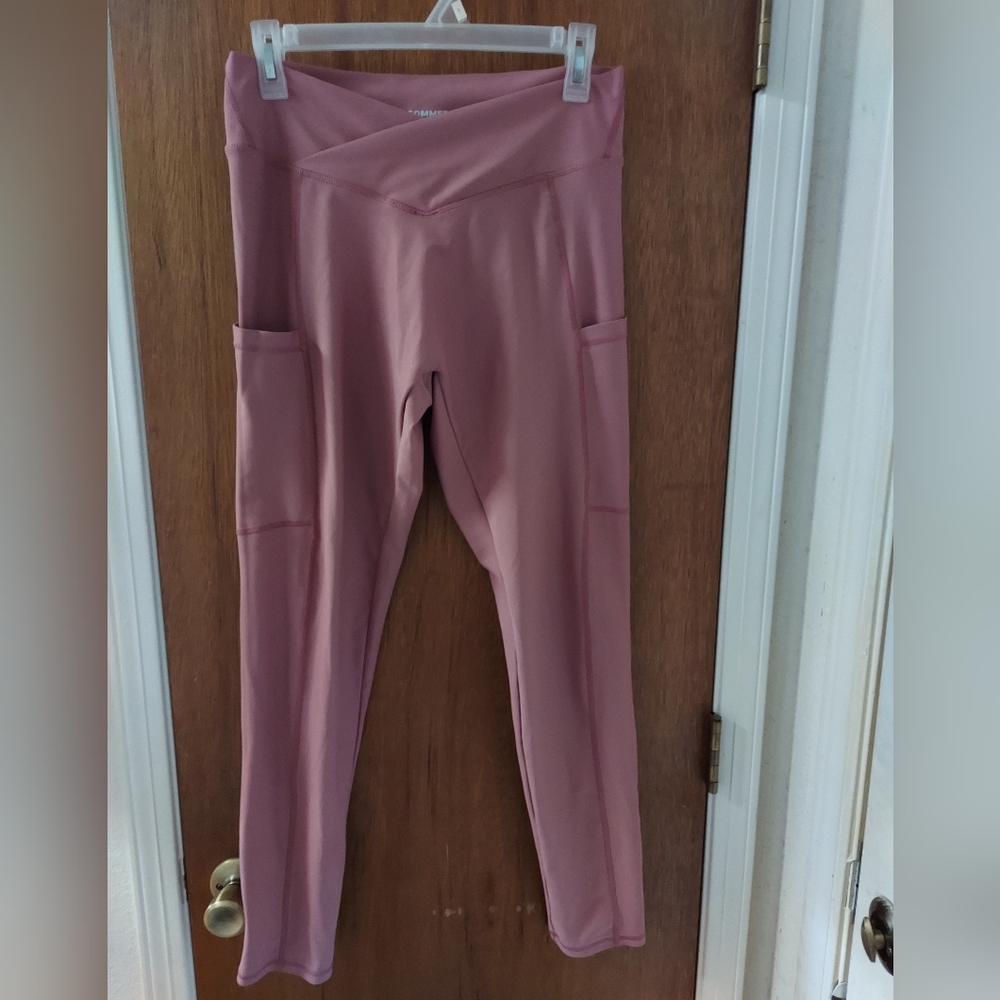 Rose colored work out pants with cell phone pockets.